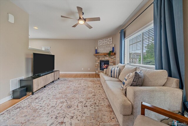 23831 Eagle Bend Ln, Parker, CO 80138 - living area featuring a ceiling fan, baseboards, light wood finished floors, a fireplace, and recessed lighting