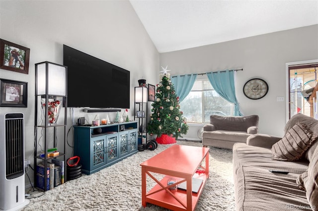 carpeted living room with vaulted ceiling