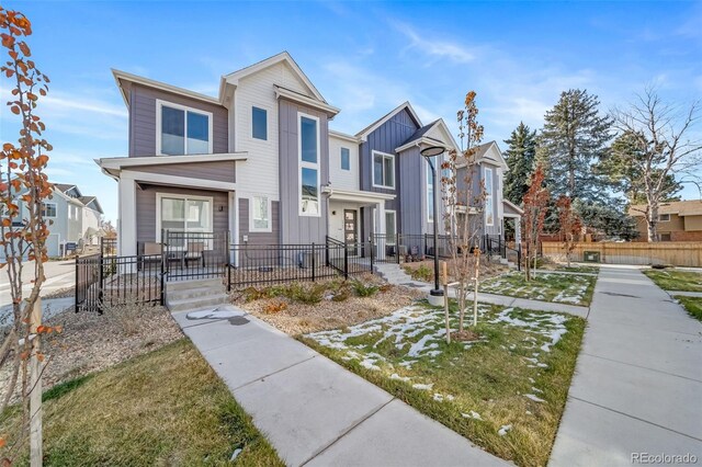 1983 S Poplar Ct, Denver, CO 80224 - view of front of house with board and batten siding and a residential view