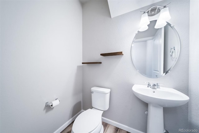 1983 S Poplar Ct, Denver, CO 80224 - half bath featuring toilet and wood finished floors