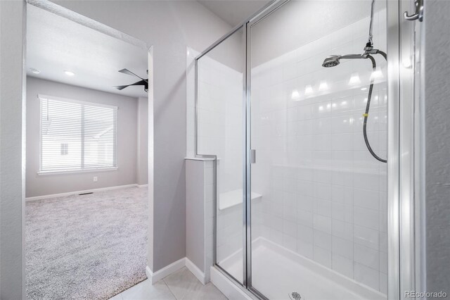 1983 S Poplar Ct, Denver, CO 80224 - full bathroom with a shower stall, ceiling fan, and tile patterned flooring