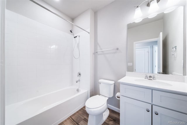 1983 S Poplar Ct, Denver, CO 80224 - full bathroom with wood finished floors, vanity, and washtub / shower combination