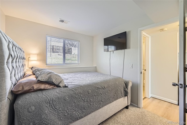 bedroom featuring wood-type flooring