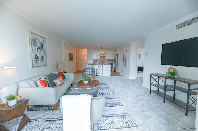 1020 15th St Unit 29L, Denver, CO 80202 - living room featuring crown molding, light carpet, and baseboards