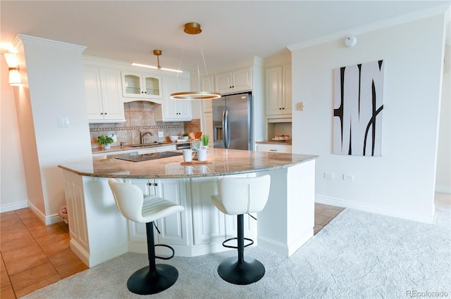 1020 15th St Unit 29L, Denver, CO 80202 - kitchen with stainless steel fridge with ice dispenser, a sink, light stone counters, backsplash, and white cabinets