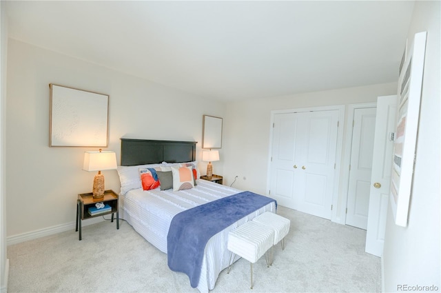 1020 15th St Unit 29L, Denver, CO 80202 - bedroom with light colored carpet, baseboards, and a closet