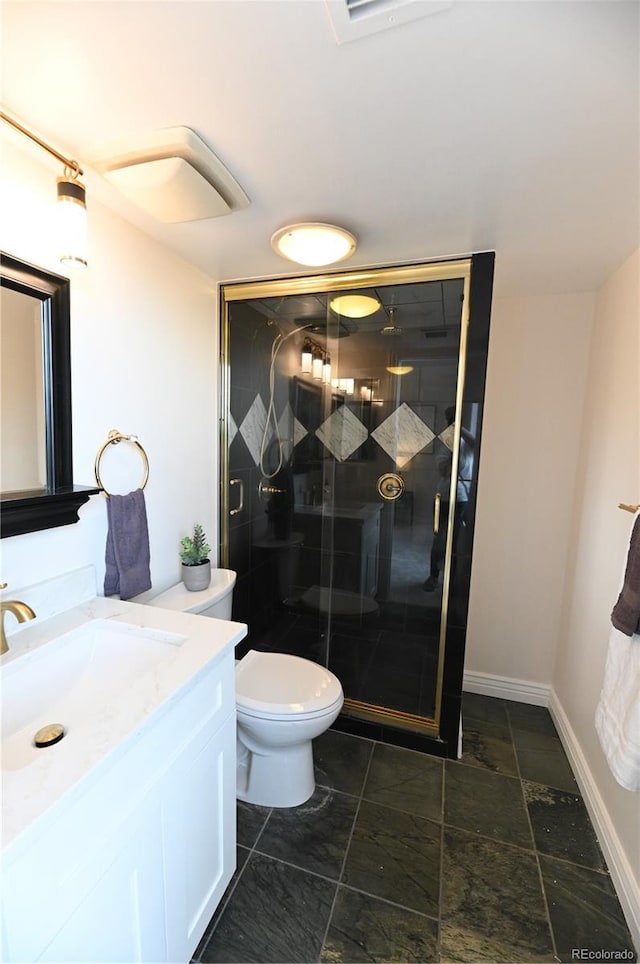 1020 15th St Unit 29L, Denver, CO 80202 - full bathroom featuring vanity, a stall shower, toilet, and baseboards