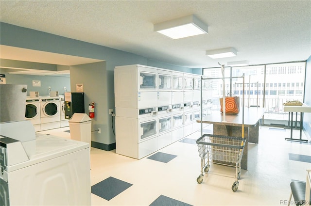 1020 15th St Unit 29L, Denver, CO 80202 - interior space featuring stacked washer and clothes dryer, separate washer and dryer, and a textured ceiling