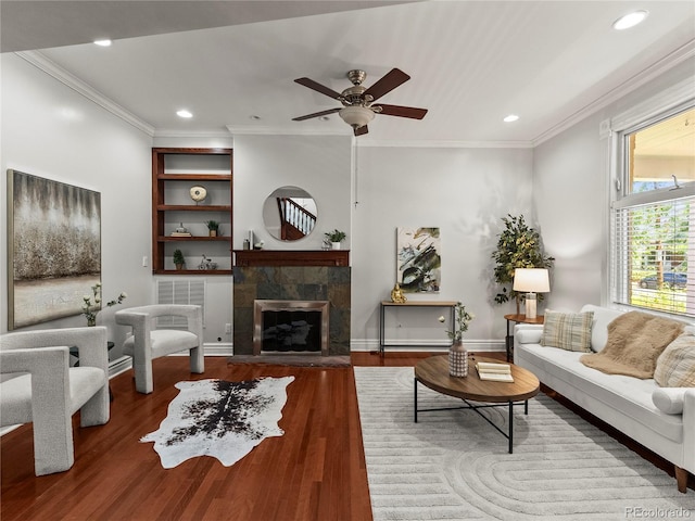 437 S Grant St, Denver, CO 80209 - living room with crown molding, a ceiling fan, recessed lighting, a fireplace, and wood finished floors