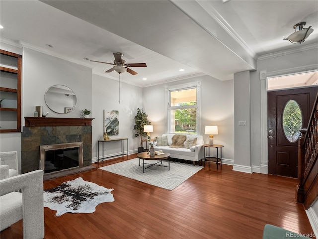 437 S Grant St, Denver, CO 80209 - living area featuring wood finished floors, ceiling fan, a fireplace, ornamental molding, and recessed lighting