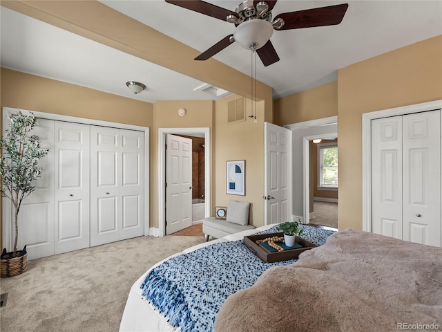 437 S Grant St, Denver, CO 80209 - carpeted bedroom featuring multiple closets, ceiling fan, and connected bathroom