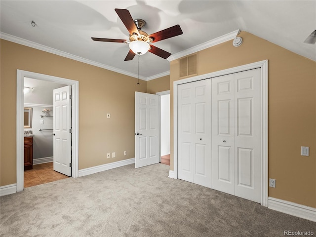 437 S Grant St, Denver, CO 80209 - unfurnished bedroom with light carpet, ornamental molding, a closet, ensuite bathroom, and a ceiling fan