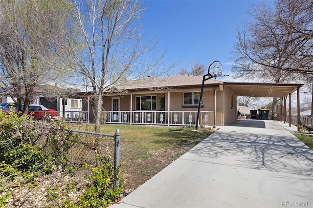single story home with driveway, a front lawn, covered porch, brick siding, and an attached carport