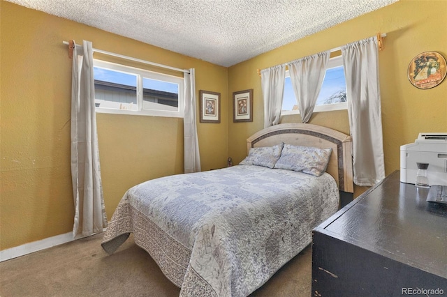 bedroom featuring baseboards, carpet floors, a textured wall, and a textured ceiling