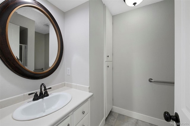 bathroom featuring vanity and baseboards