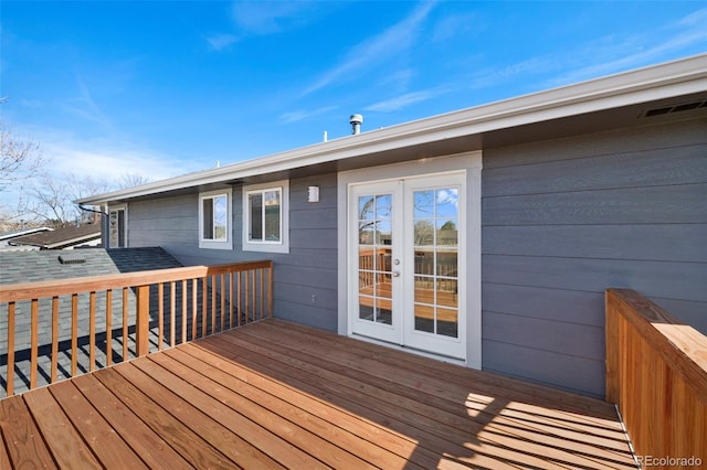 wooden deck with visible vents and french doors