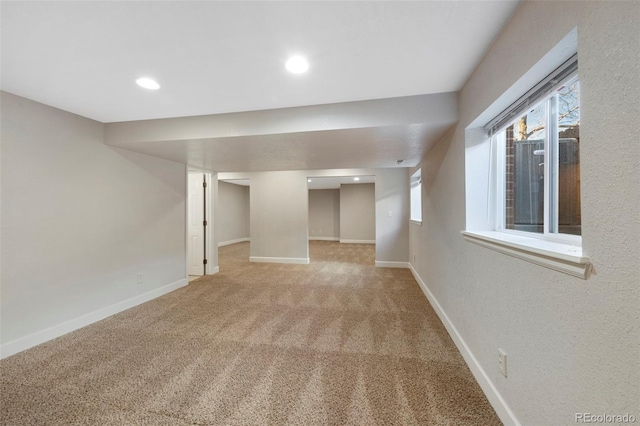 below grade area with carpet, baseboards, and recessed lighting