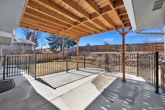 view of patio / terrace with a fenced backyard and visible vents