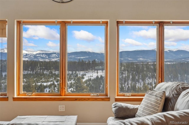 sunroom / solarium with a wealth of natural light and a mountain view