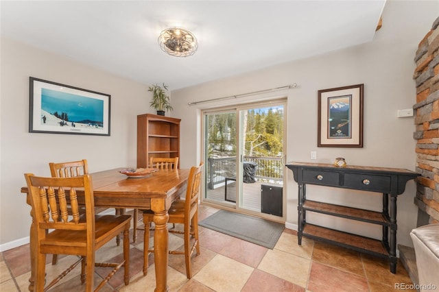 dining room with baseboards