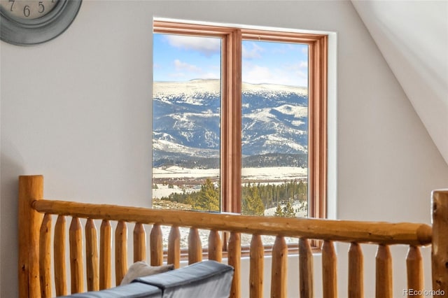 bedroom featuring a mountain view and lofted ceiling