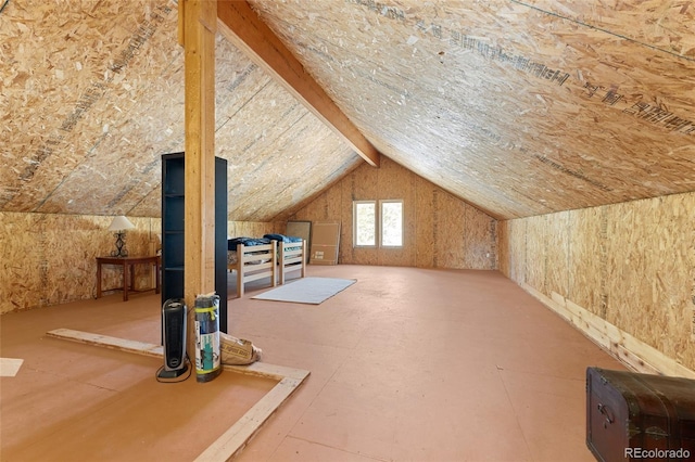 bonus room featuring vaulted ceiling