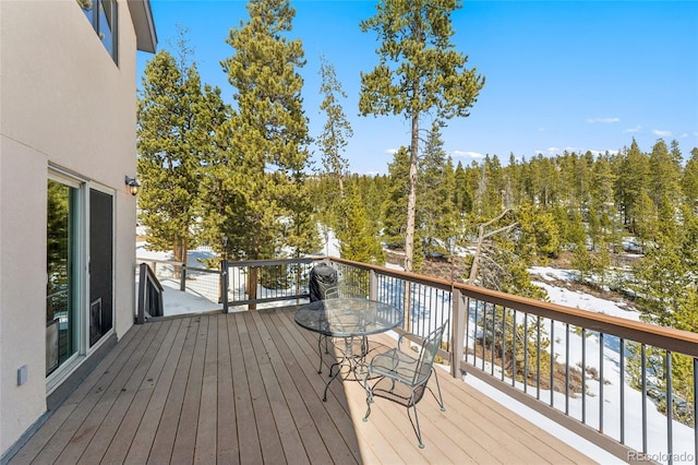 deck featuring a forest view