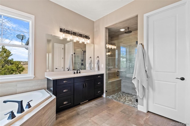 9563 Red Primrose St, Franktown, CO 80116 - bathroom featuring a shower stall, vanity, and a bath