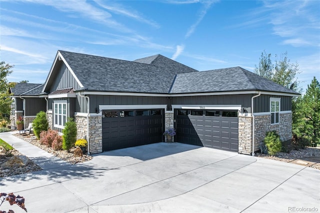9563 Red Primrose St, Franktown, CO 80116 - view of home's exterior with stone siding, roof with shingles, and an attached garage