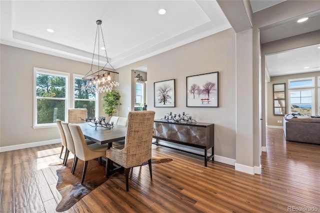 9563 Red Primrose St, Franktown, CO 80116 - dining room featuring a tray ceiling, healthy amount of natural light, baseboards, recessed lighting, and wood finished floors