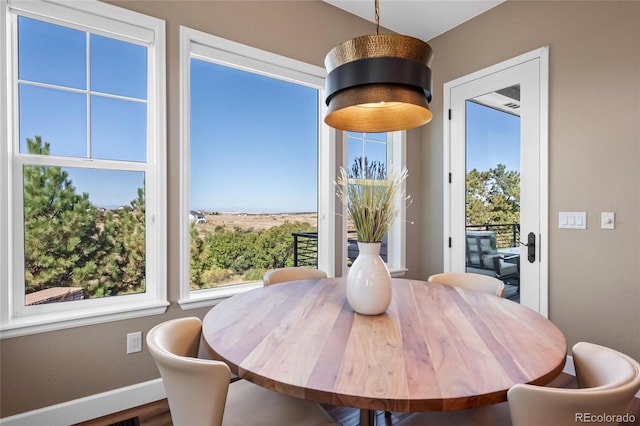 9563 Red Primrose St, Franktown, CO 80116 - dining room featuring baseboards and wood finished floors