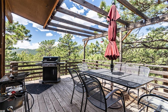 398 Leonards Rd, Boulder, CO 80302 - wooden terrace featuring grilling area, outdoor dining space, and a pergola