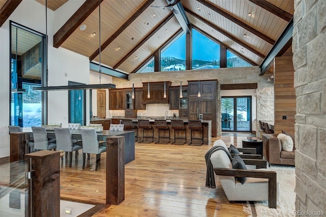 65 Aerie Dr, Silverthorne, CO 80498 - living room with high vaulted ceiling, light wood-style flooring, and a wood ceiling with exposed beams