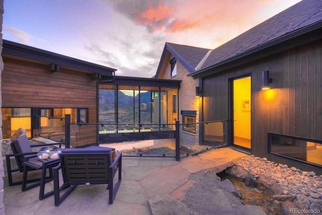 65 Aerie Dr, Silverthorne, CO 80498 - patio terrace at dusk featuring a sunroom