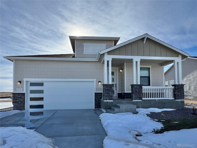 craftsman-style house with a garage and covered porch