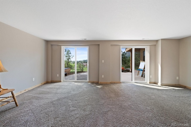 776 Hilltop Rd, Palmer Lake, CO 80133 - unfurnished living room with baseboards, visible vents, and carpet floors