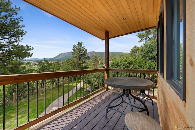 776 Hilltop Rd, Palmer Lake, CO 80133 - wooden terrace with a mountain view