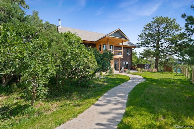 776 Hilltop Rd, Palmer Lake, CO 80133 - exterior space with a balcony and a front lawn