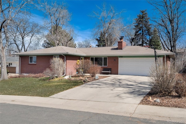 ranch-style home featuring driveway, a front yard, a garage, brick siding, and a chimney