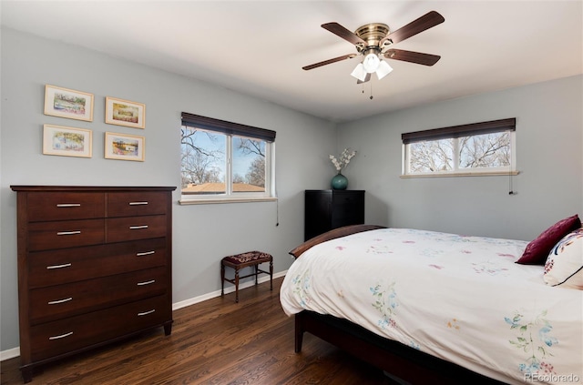 bedroom featuring dark wood finished floors, baseboards, and ceiling fan