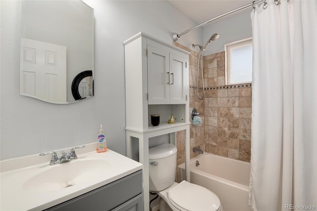 bathroom with shower / tub combo with curtain, vanity, and toilet