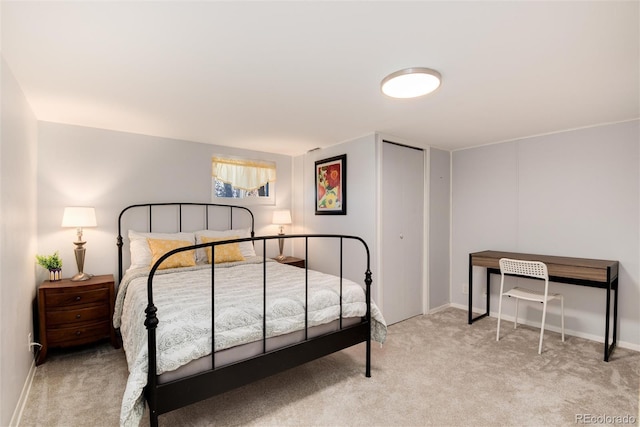 carpeted bedroom featuring baseboards