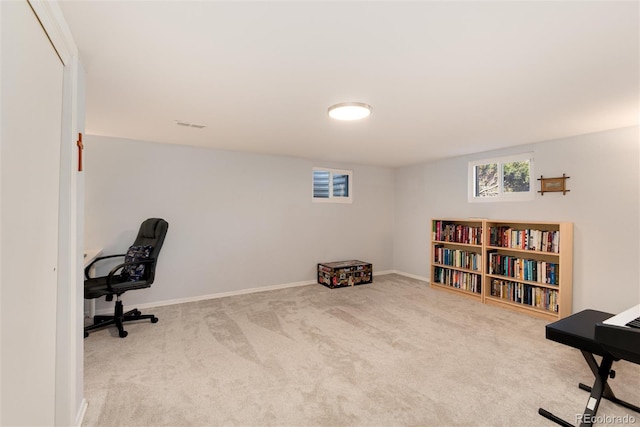 carpeted home office featuring baseboards