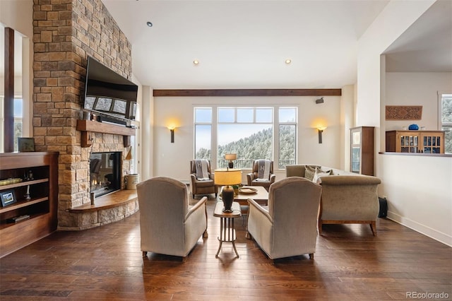 living room with dark hardwood / wood-style floors and a fireplace