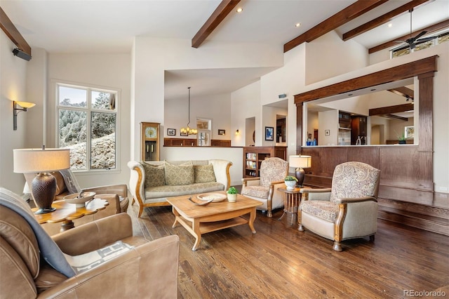 living room with hardwood / wood-style floors, beam ceiling, and high vaulted ceiling