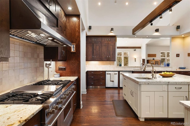 kitchen featuring sink, appliances with stainless steel finishes, light stone counters, ventilation hood, and white cabinets