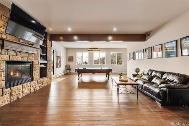 rec room featuring hardwood / wood-style flooring, a stone fireplace, billiards, and beamed ceiling