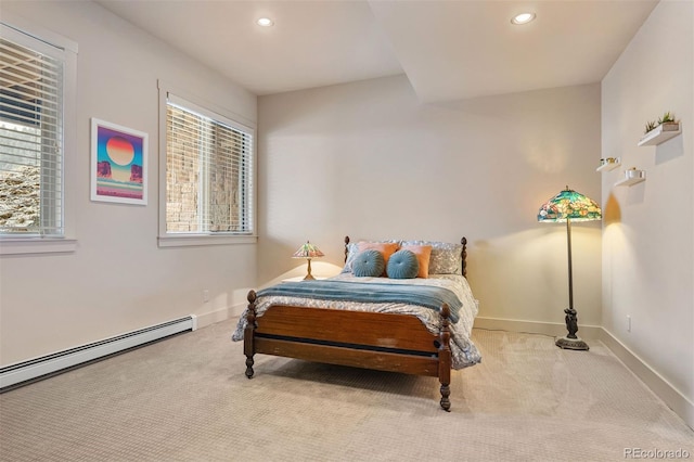 carpeted bedroom with baseboard heating