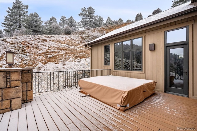 view of snow covered deck