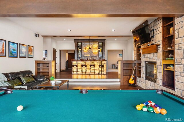 21609 Clarence Ln, Golden, CO 80401 - game room with billiards, wood finished floors, a dry bar, a fireplace, and built in features